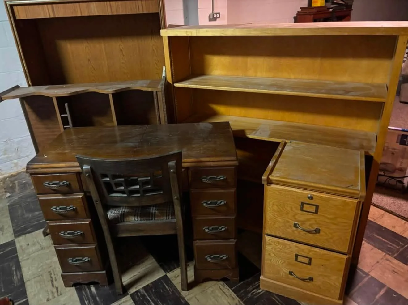 Solid wood executive office desk and wooden cabinetry prepared for donation pickup in Spokane