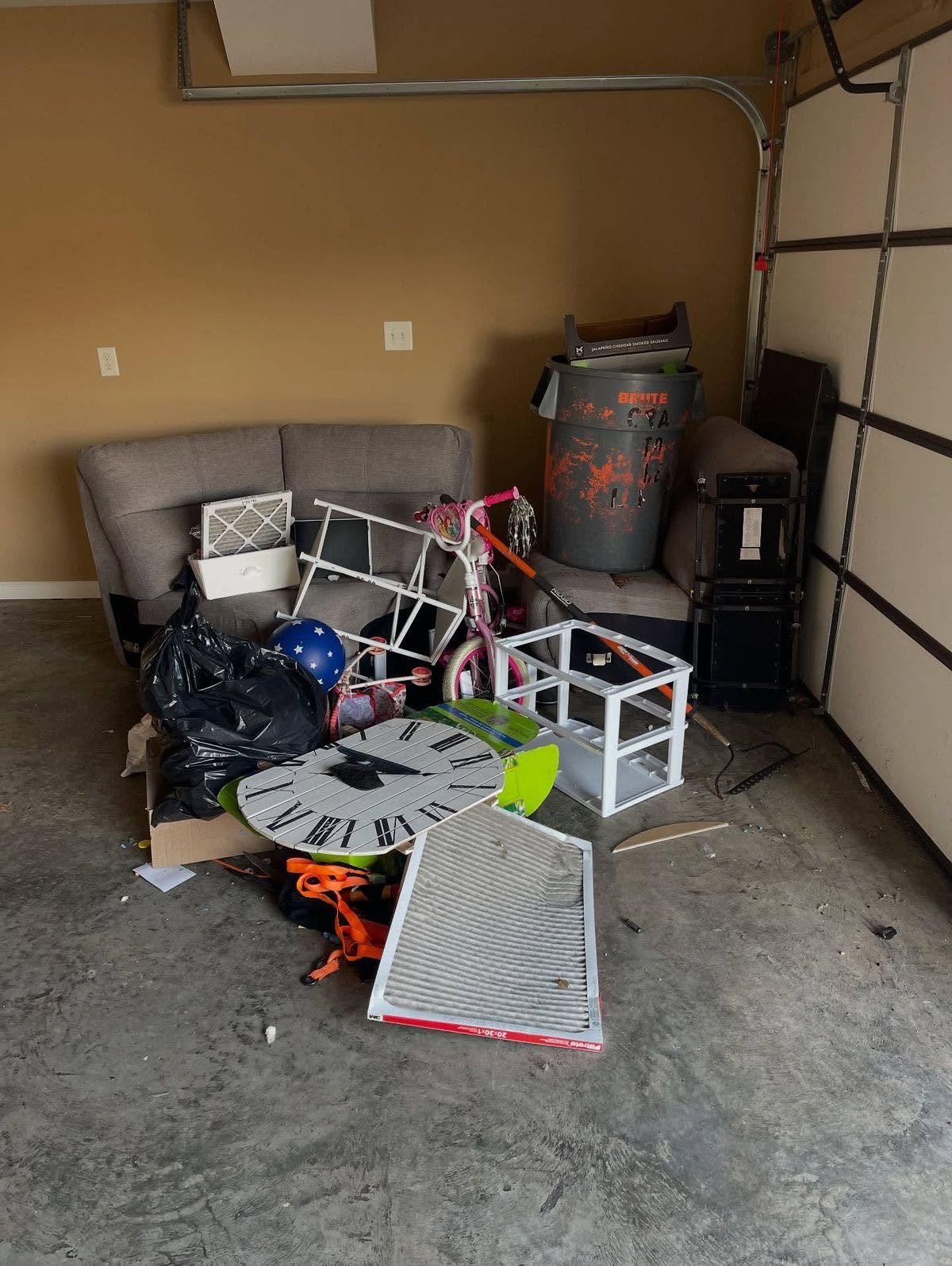 Old sofa and storage items removed from garage in Mead