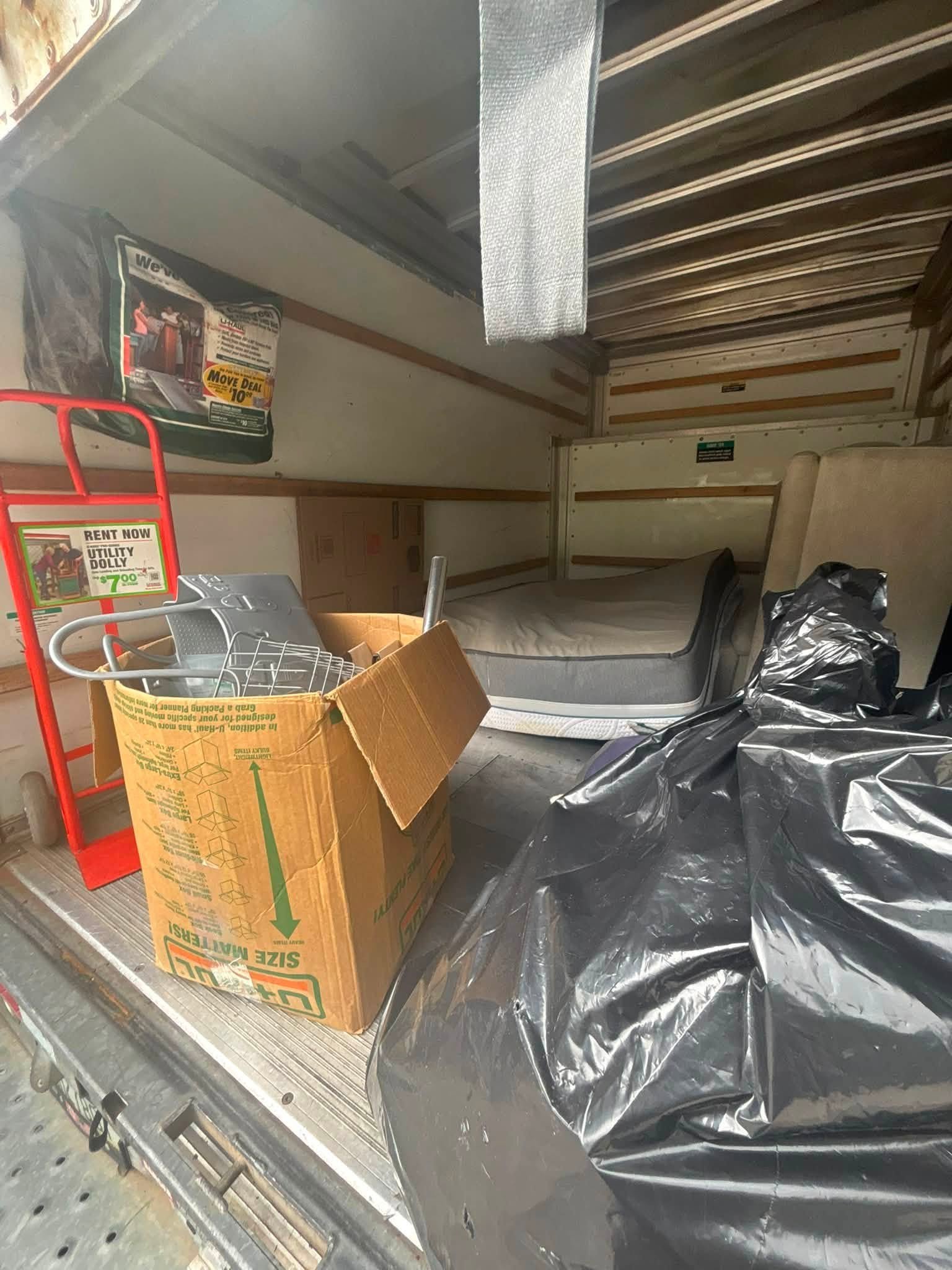 Moving truck loaded with mattress for junk cleanout in Spokane